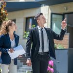 How Much Will An Investor Pay For My House Real estate investors walking around a house they may purchase