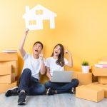 How Long Should You Keep A House Before You Sell It? couple moving in a new home after they sell a house