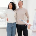 A couple selling their house to a cash home buyer