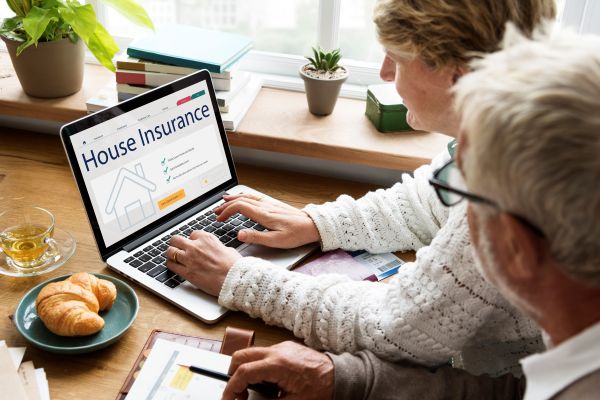 Homeowners discussing open insurance claim