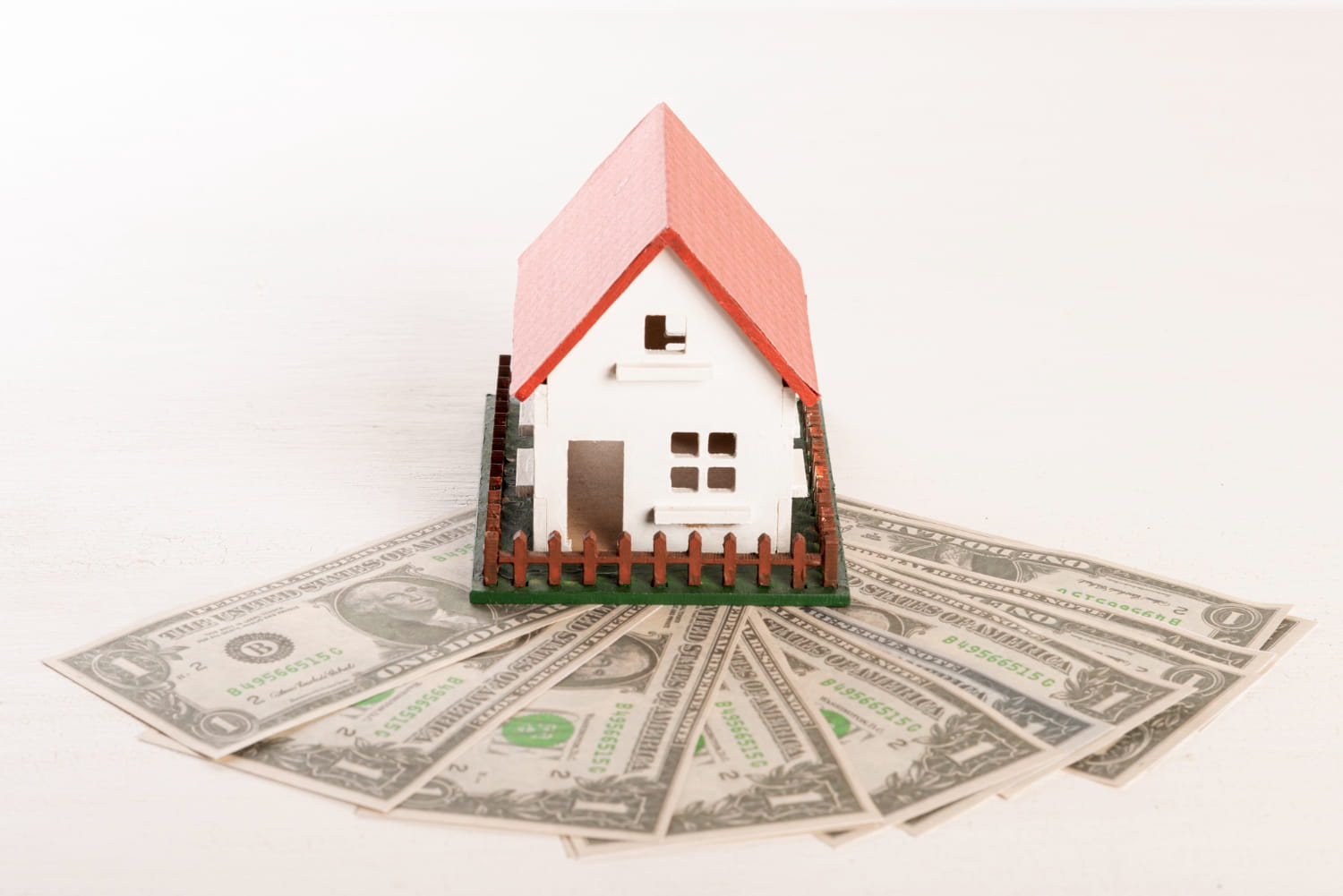 A miniature house and money