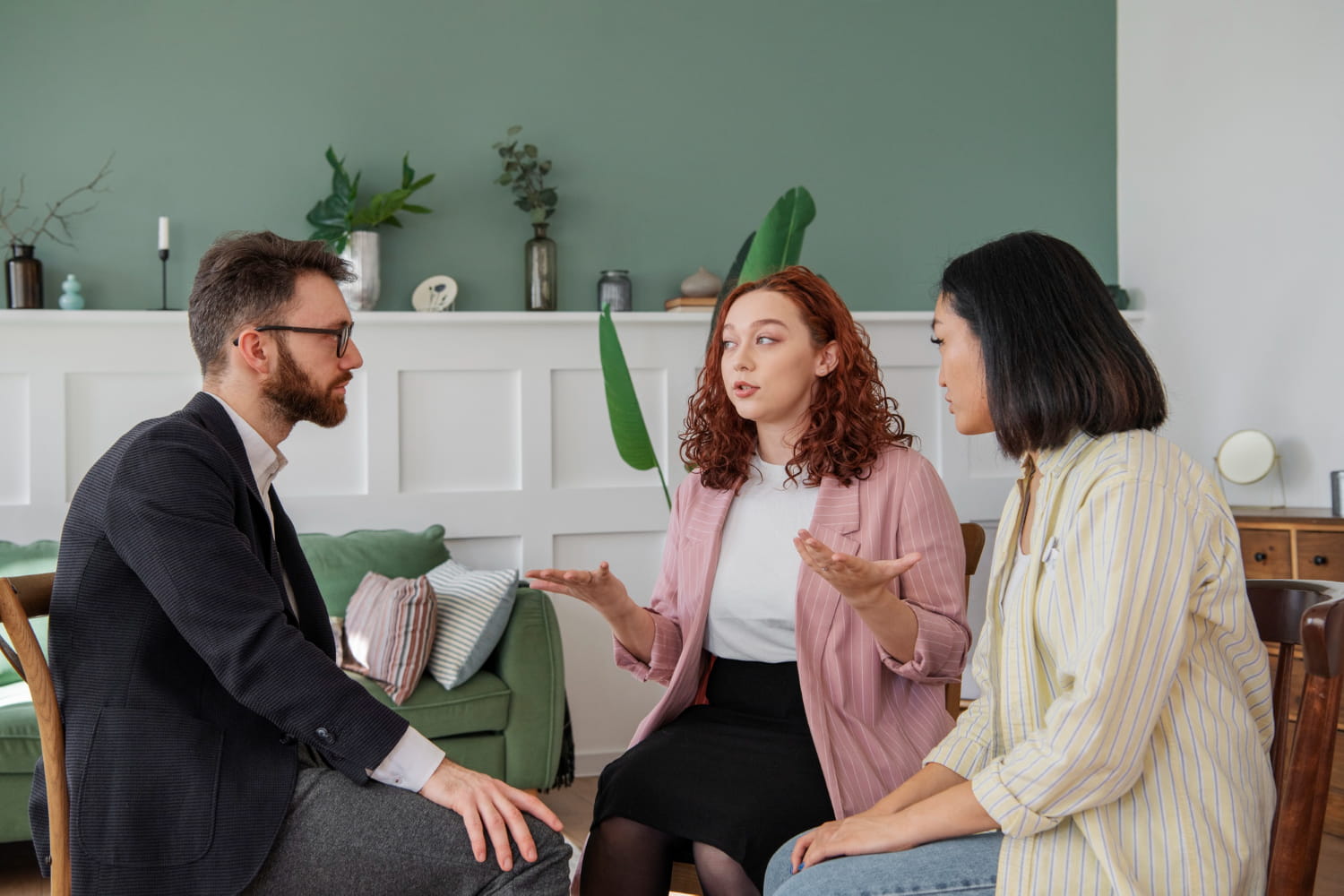 A woman accompanied by her friend, talking to a real estate lawyer