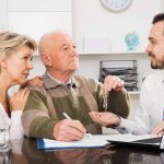 Couple finalizing home sale paperwork