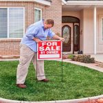 What Part Takes The Longest When Selling A House? Man advertising house with for sale sign