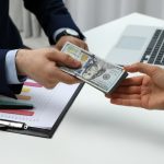 Should I Take An All-Cash Offer On My House? Man buying a house through cash offer