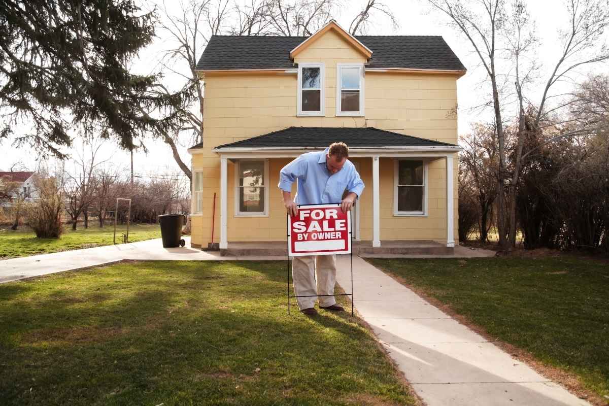 sell my house as is Man preparing to sell his small house