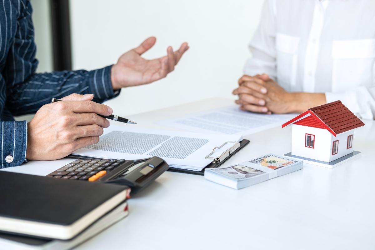 home buying company in worcester Seller negotiating with an agent to sell house fast