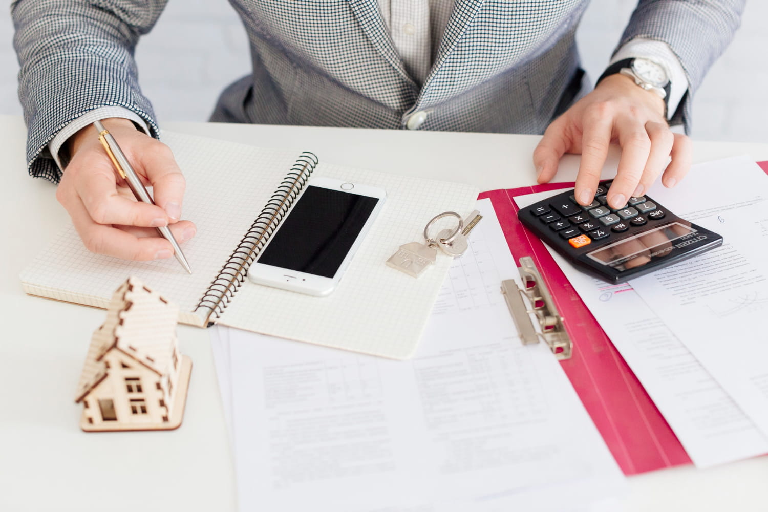 1.A man keeping his mortgage records after selling the house A man keeping his mortgage records after selling the house