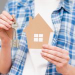 I'm A Landlord Selling A House: How Do I Handle Renters Living In It? A person selling a house while holding the key