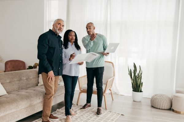 A couple consulting a real estate agent