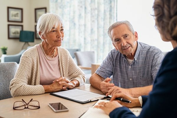 Financial expert guiding couple on rent and housing