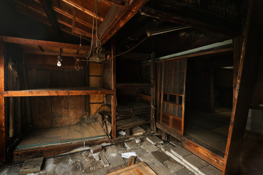 Deteriorated room with exposed beams illustrating selling a house in poor condition challenges.