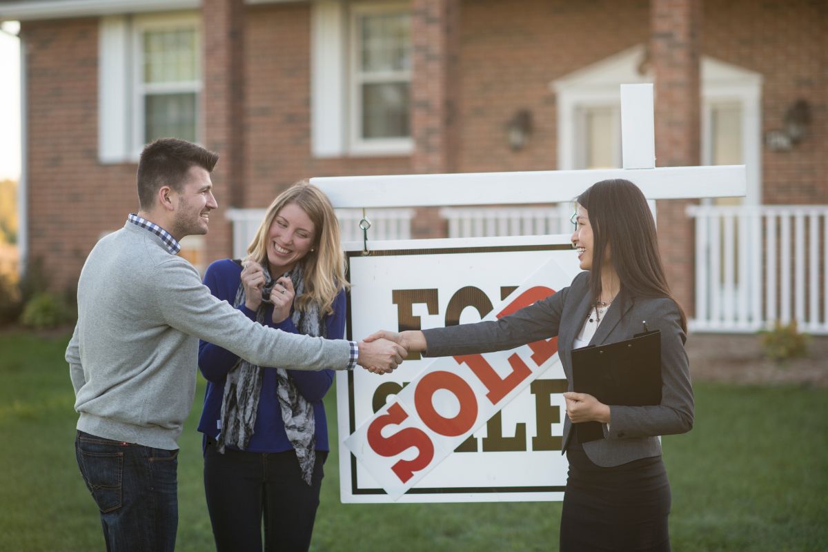 Agent and buyer close a home deal.