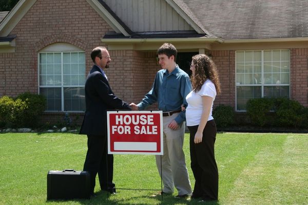 Client discussing property options with agent