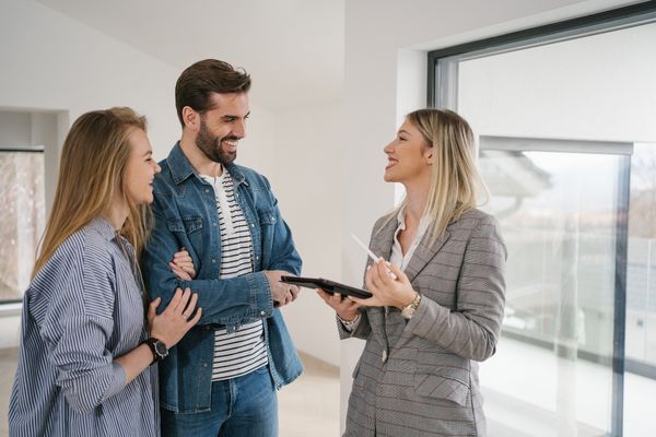Couple meeting an agent to sell the house