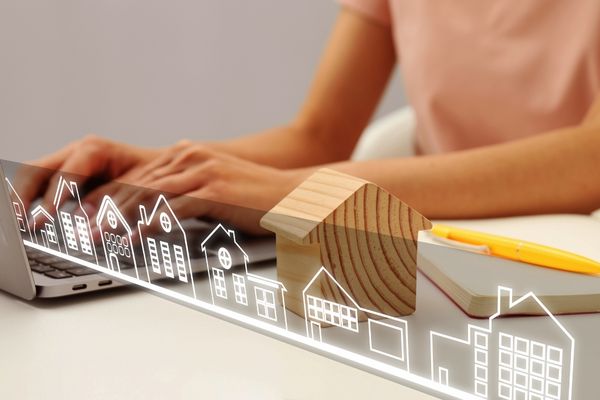 Woman managing real estate home relist