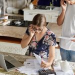 The Paperwork You Need When Selling A House For Cash Couple reviewing paperwork for cash home sale