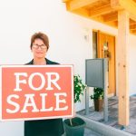 Smiling woman ready to sell a house