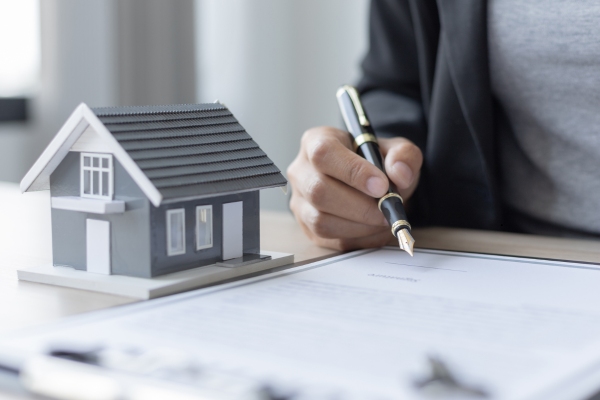 Homeowner reviewing offer before selling their house.