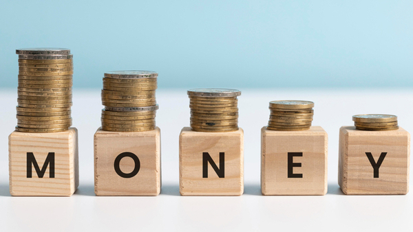 Declining coin stacks representing Boston housing market 2025 neighborhood price comparisons and affordability.