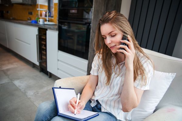 woman talking to a home buying company