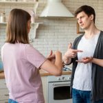 Should I Sell My House As Is Or Fix It Up? 1.Couple discussing whether to sell their house as-is or make repairs
