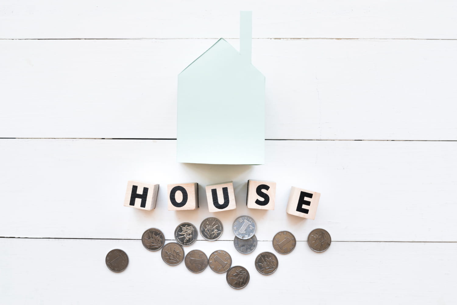 Miniature House With Coins