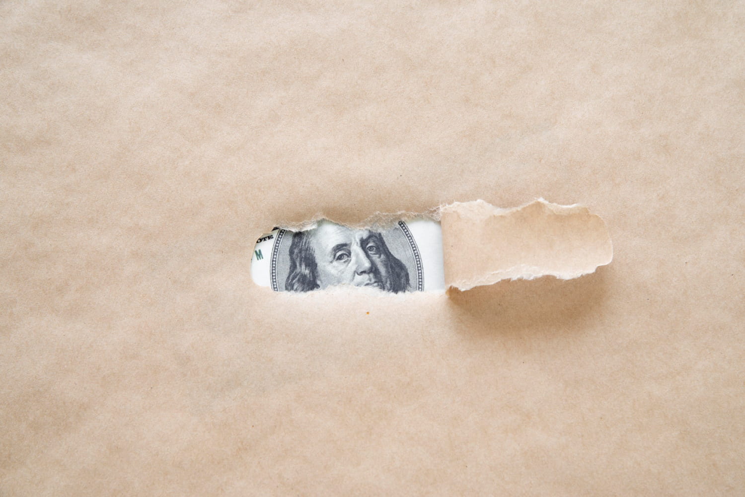 Money Hidden at the Back of the Paper