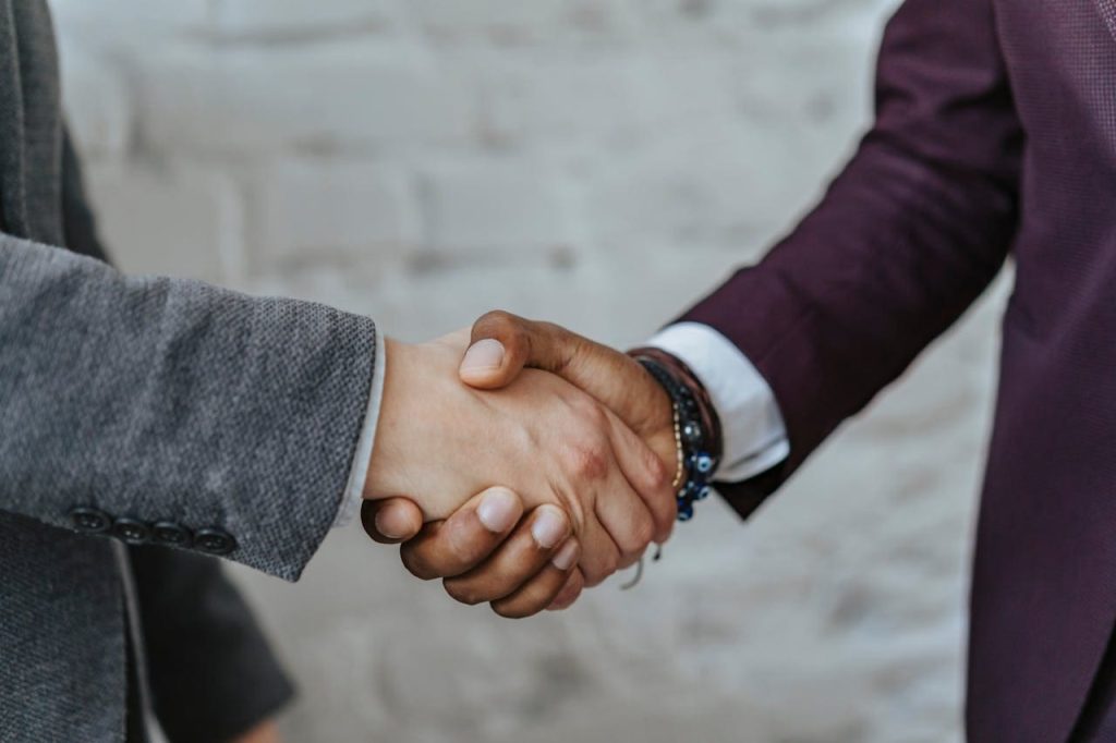 hand shake after a house for sale negotiation