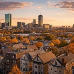 Renting Vs. Buying A Home In Greater Boston: What The 2026 Numbers Actually Tell You Boston skyline with residential neighborhoods showing rent vs buy housing market